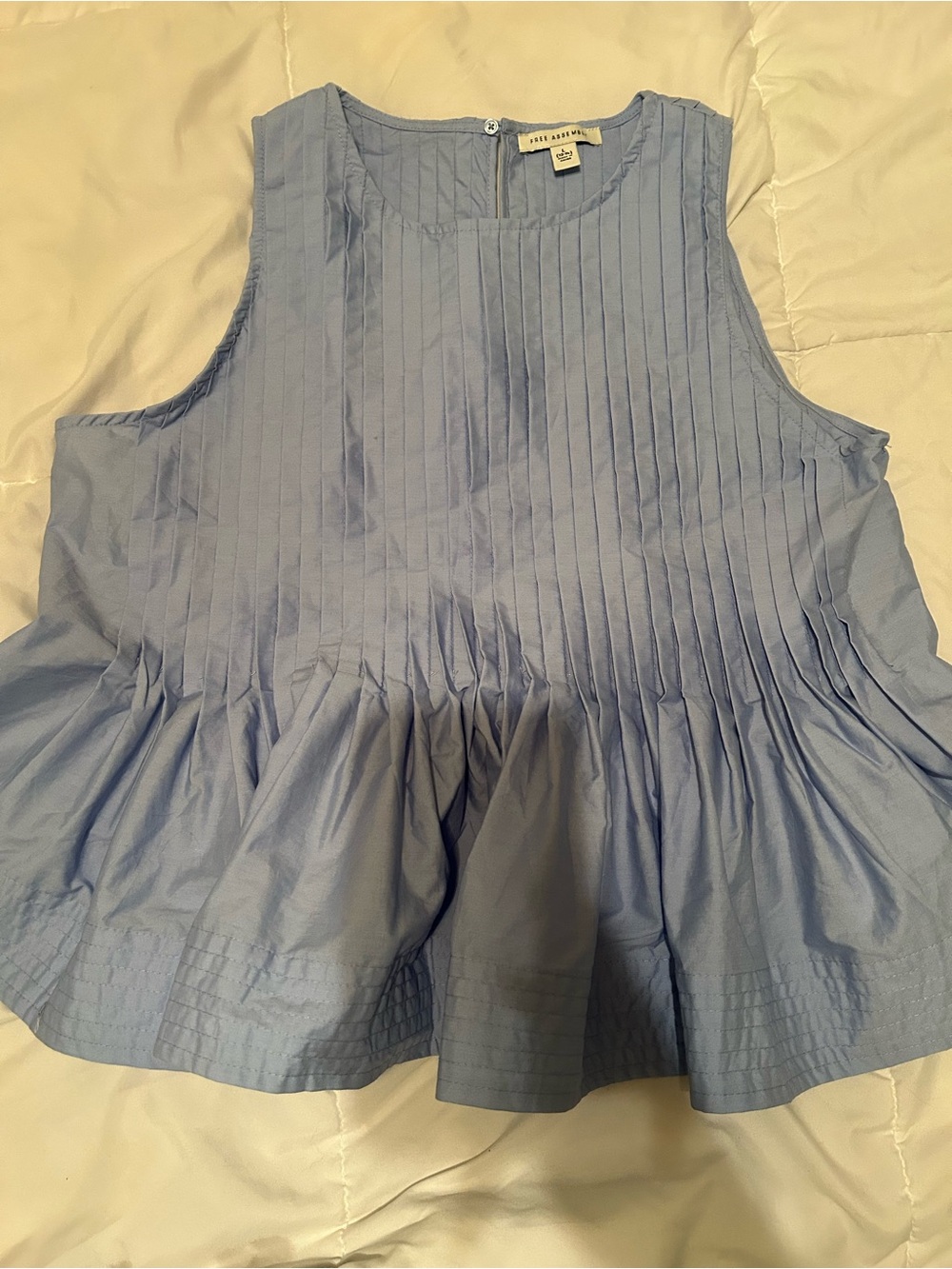 Pleated Light Blue Peplum sleeveless blouse